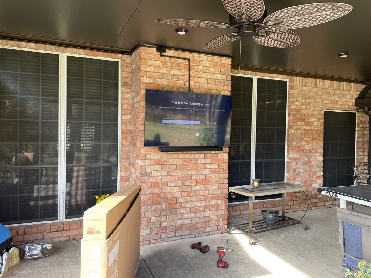 Covered brick patio TV and soundbar outdoor audio McKinney TX